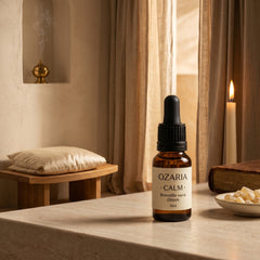 CALM ambient mood — bottle on a desk with brass lamp and library backdrop