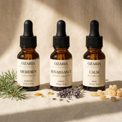 OZARIA The Founder's Set — three single-origin oils on cream linen