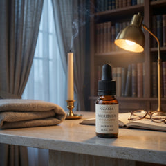 MERIDIEN ambient mood — bottle on a desk with brass lamp and library backdrop