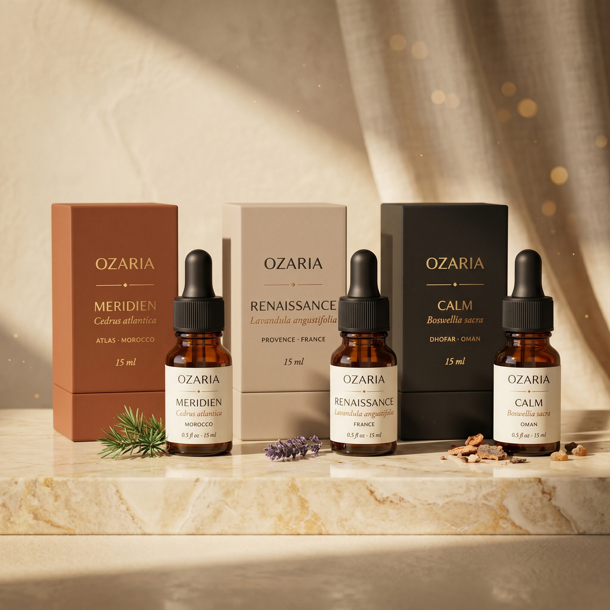 OZARIA Founder's Set — three single-origin essential oils with their luxury packaging boxes